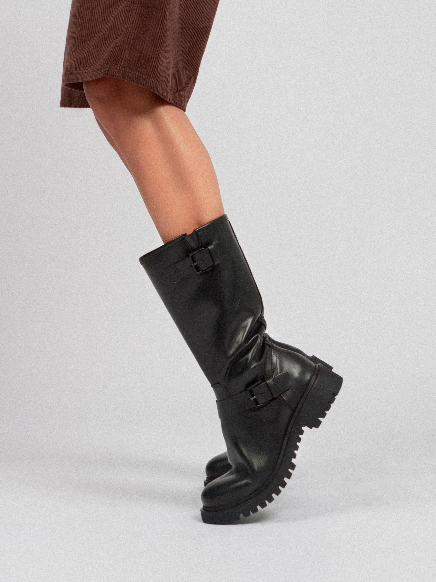 Black calfskin biker with side straps and rubber tread
