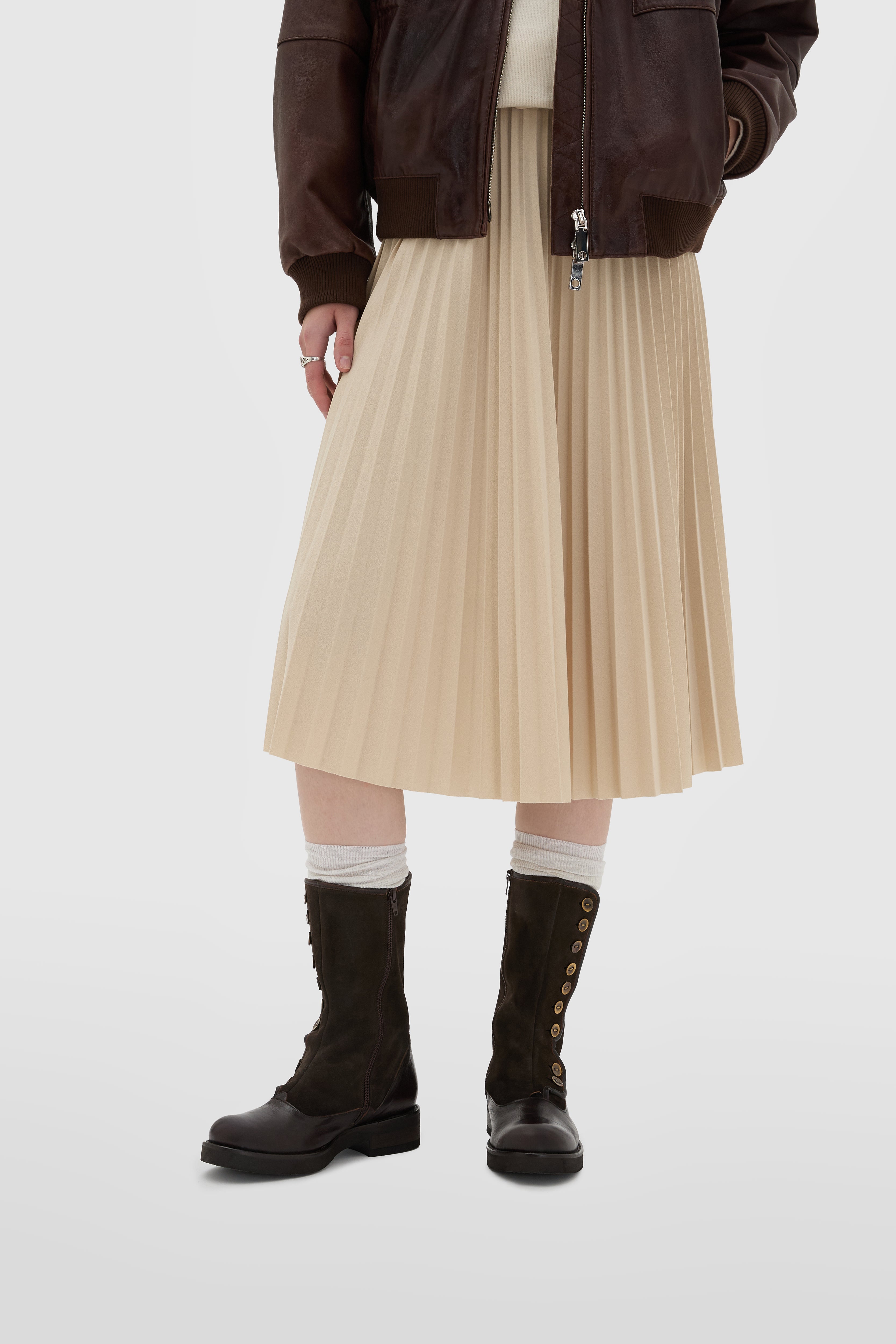 Dark brown calfskin boot with metal buttons and low heel