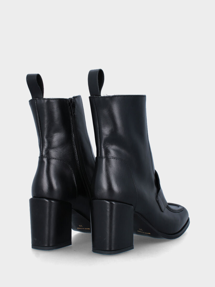 Bottine noire en cuir avec languette et bride à tête de lion