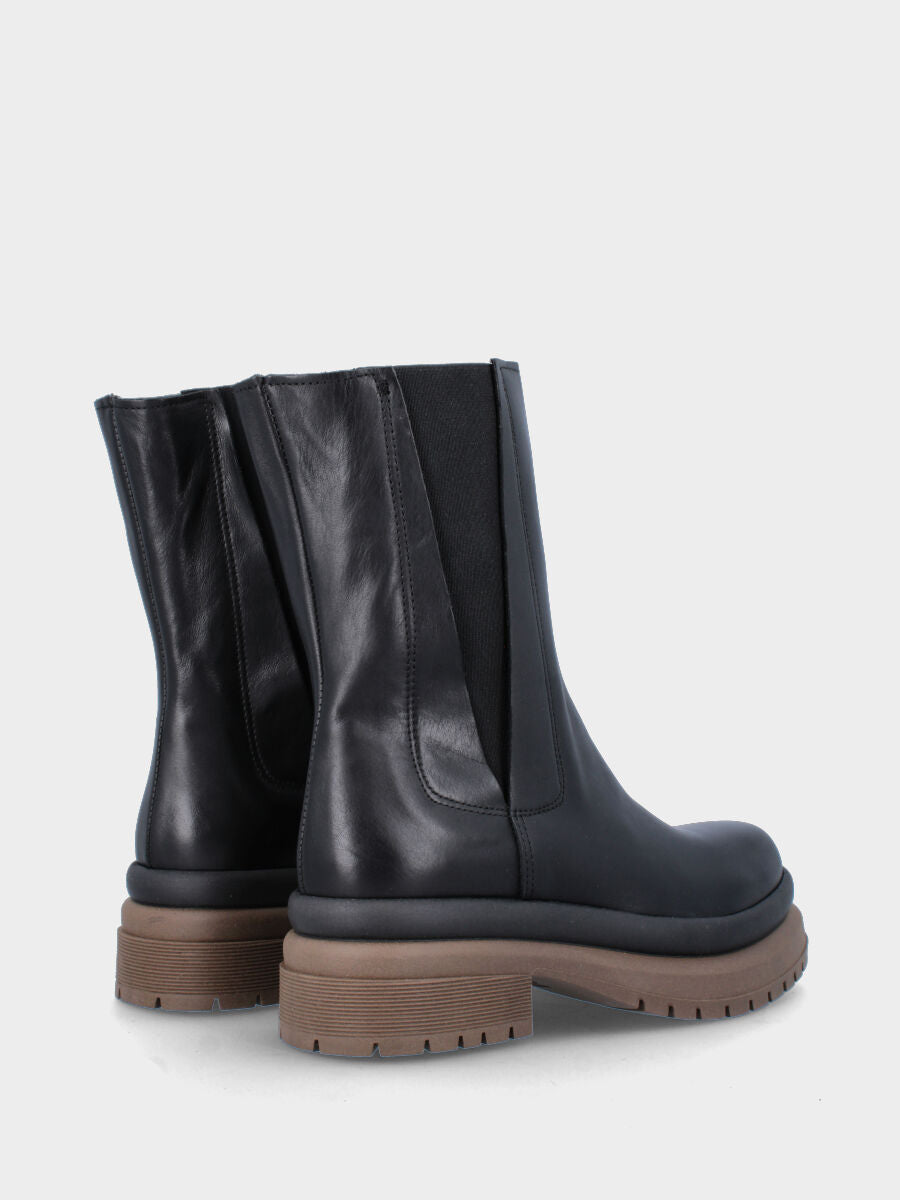 Black leather ankle boot with covered elastics and rubber welt