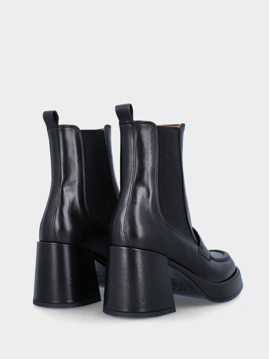 Bottine noire en cuir avec plateau et bride à boucle