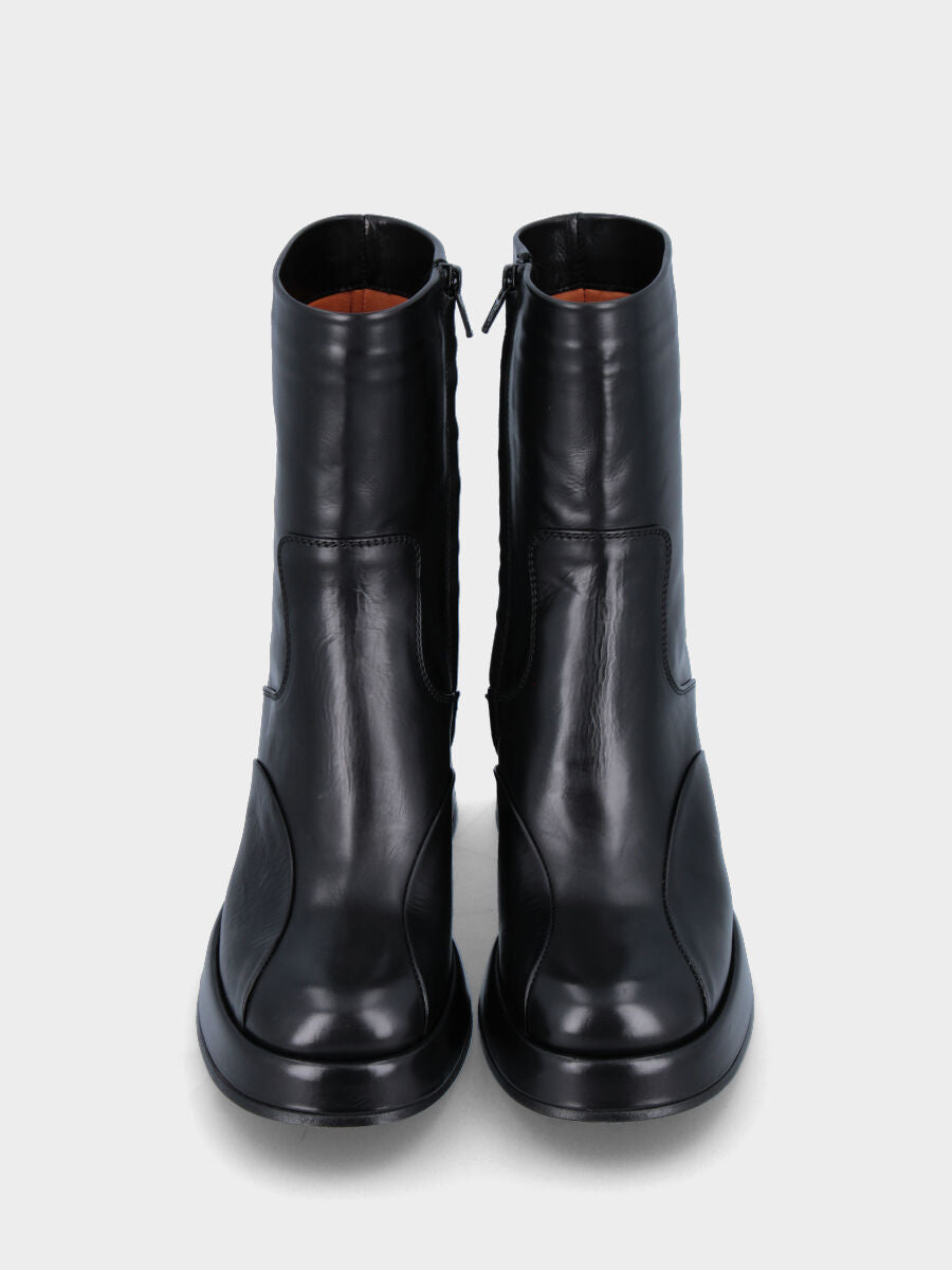 Black leather ankle boot with stitched joint mask