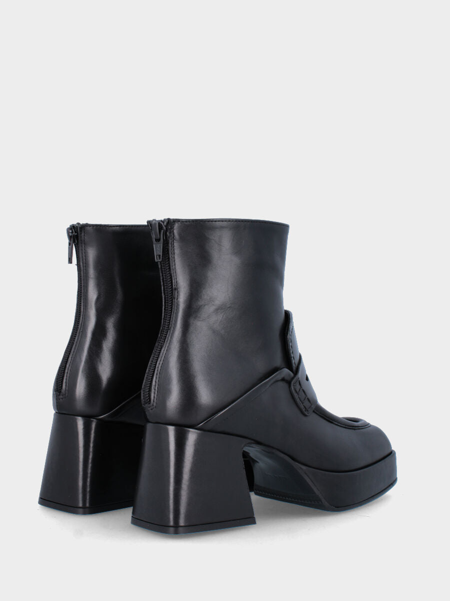 Black leather ankle boot with tab and strap