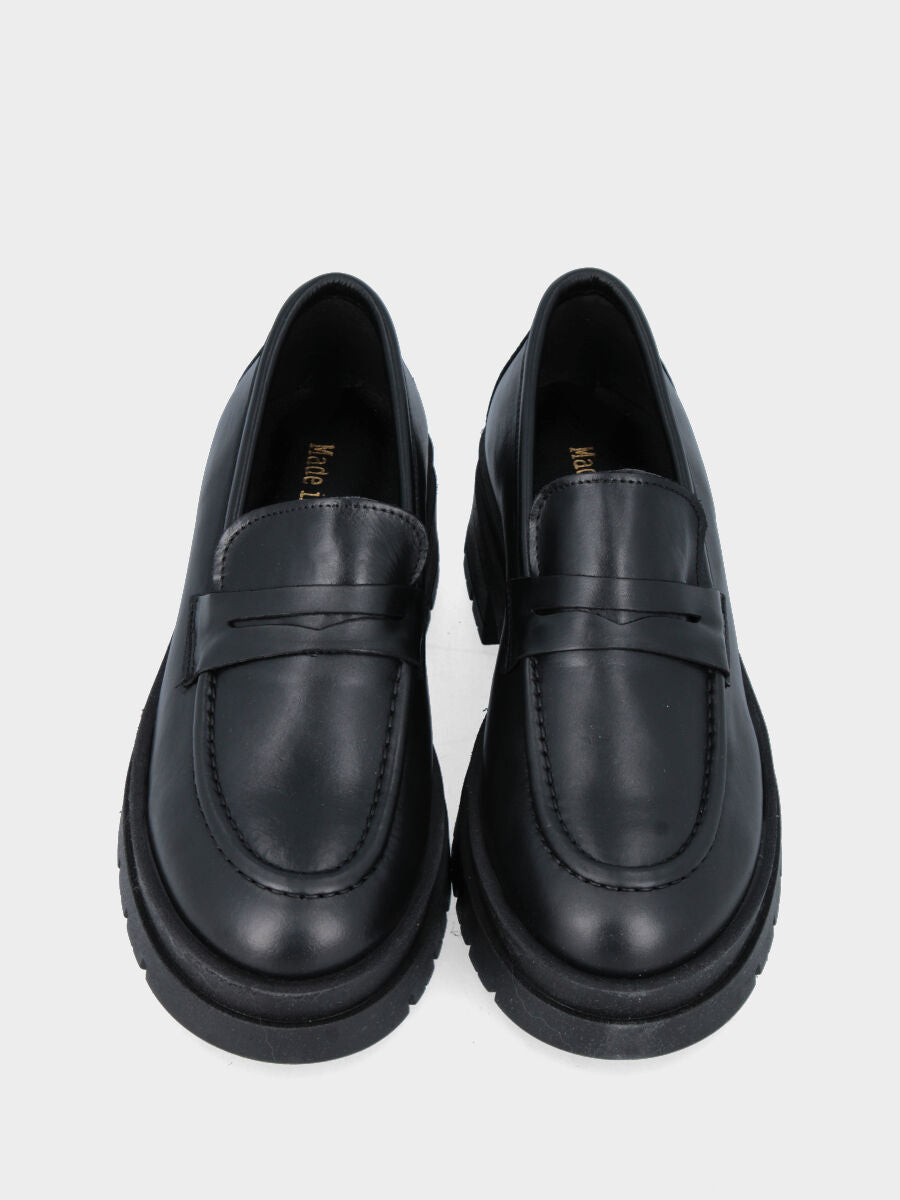 Black leather loafer with strap and combat sole