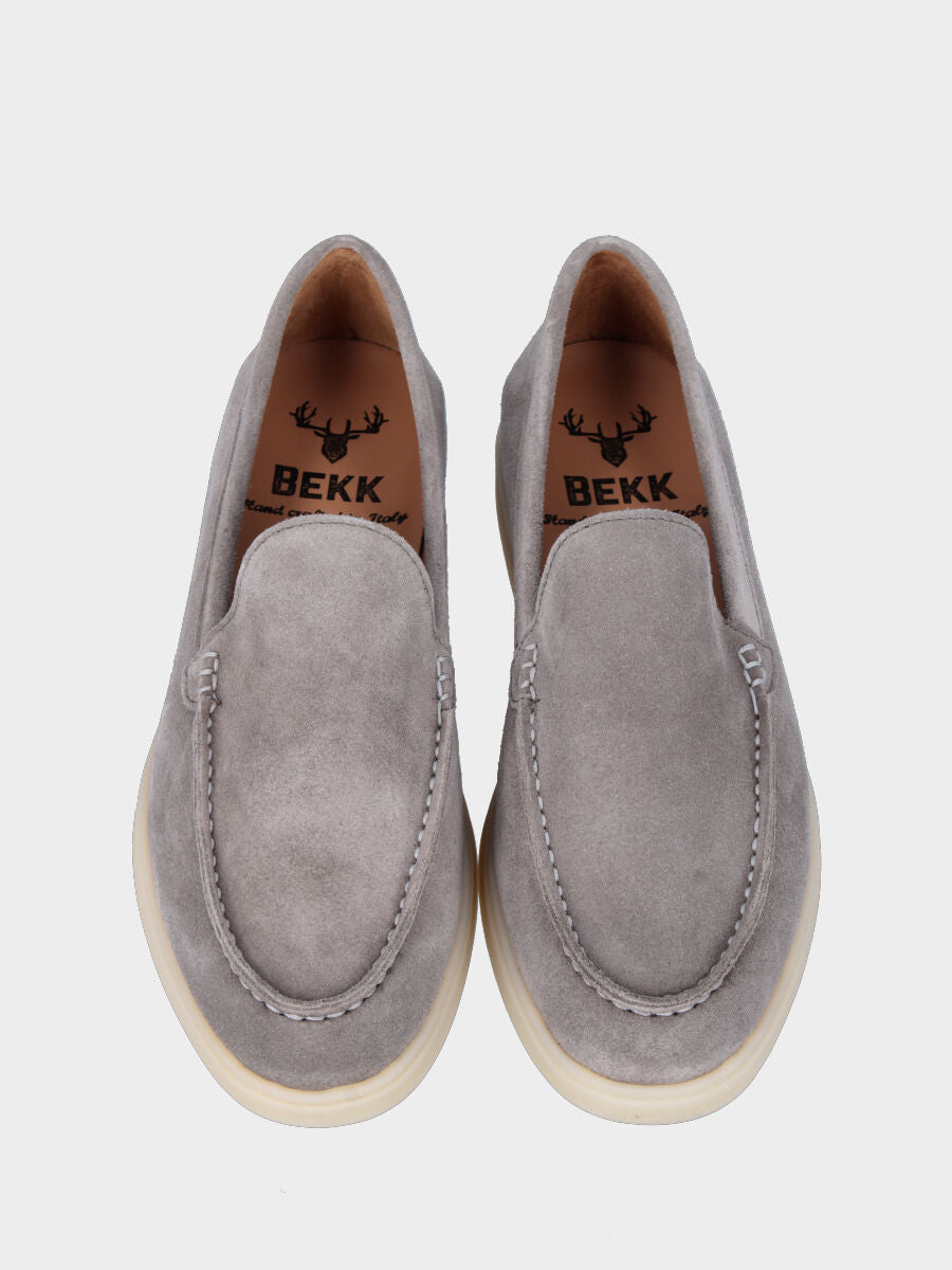 Gray suede moccasin with stitched tray joint to the upper