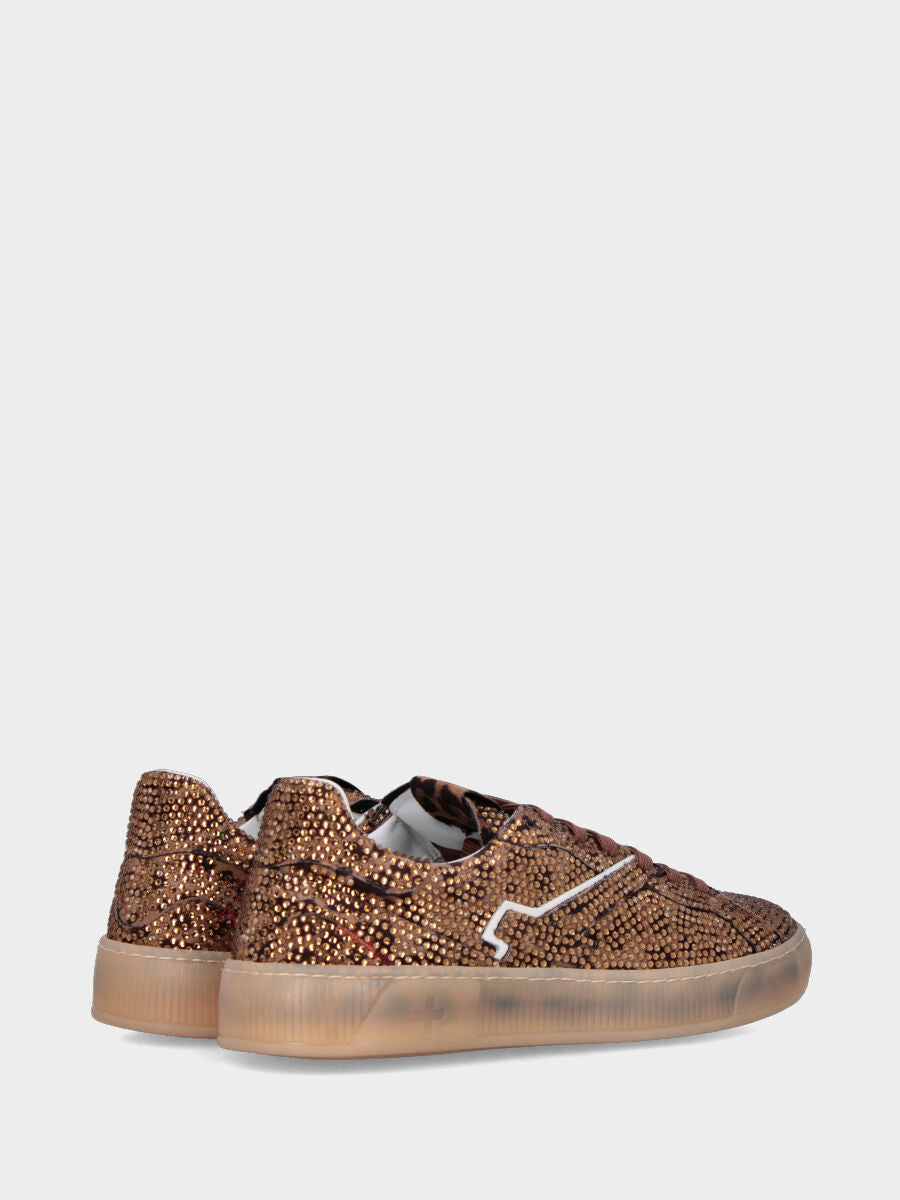 Sneaker in cavallino maculato con multistrass e suola in gomma