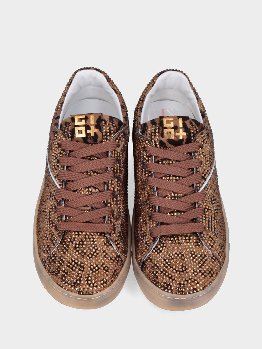 Sneaker in cavallino maculato con multistrass e suola in gomma