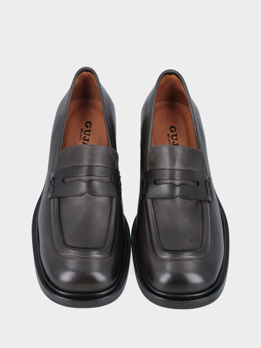 Moccasin in dark brown calfskin with lion's mouth mask