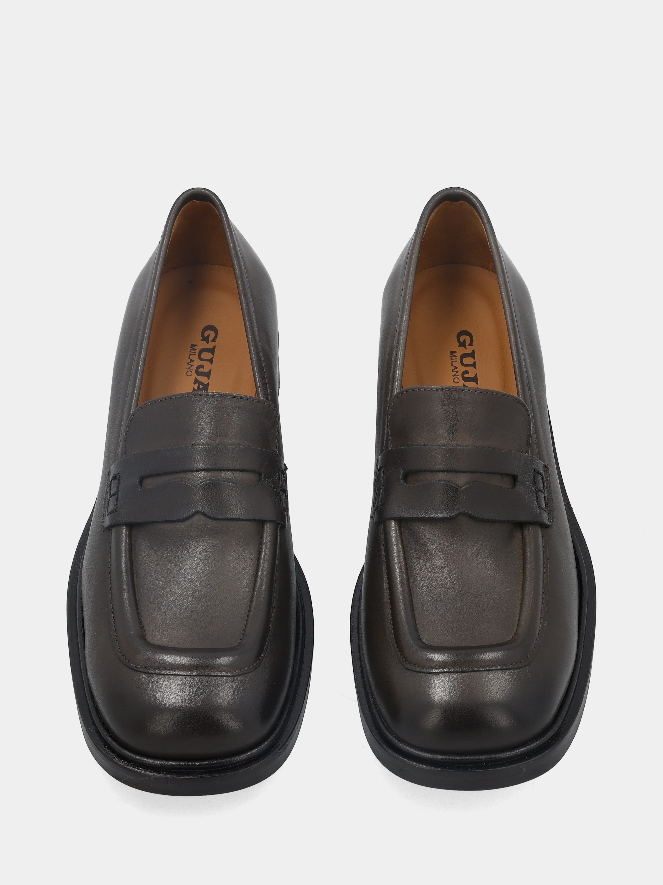 Moccasin in dark brown calfskin with lion's mouth mask