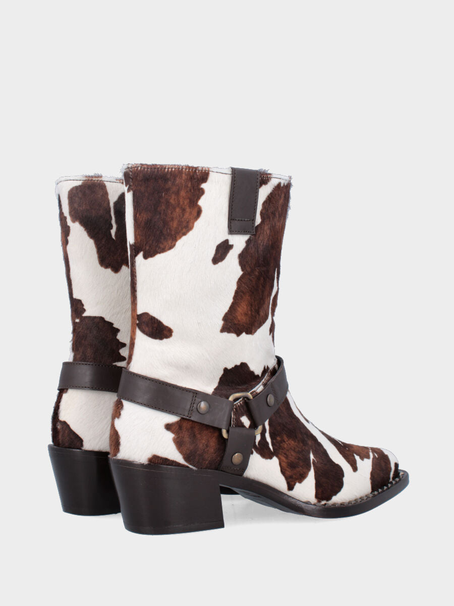 Bottines western en cuir façon poulain moucheté avec clous et étrier
