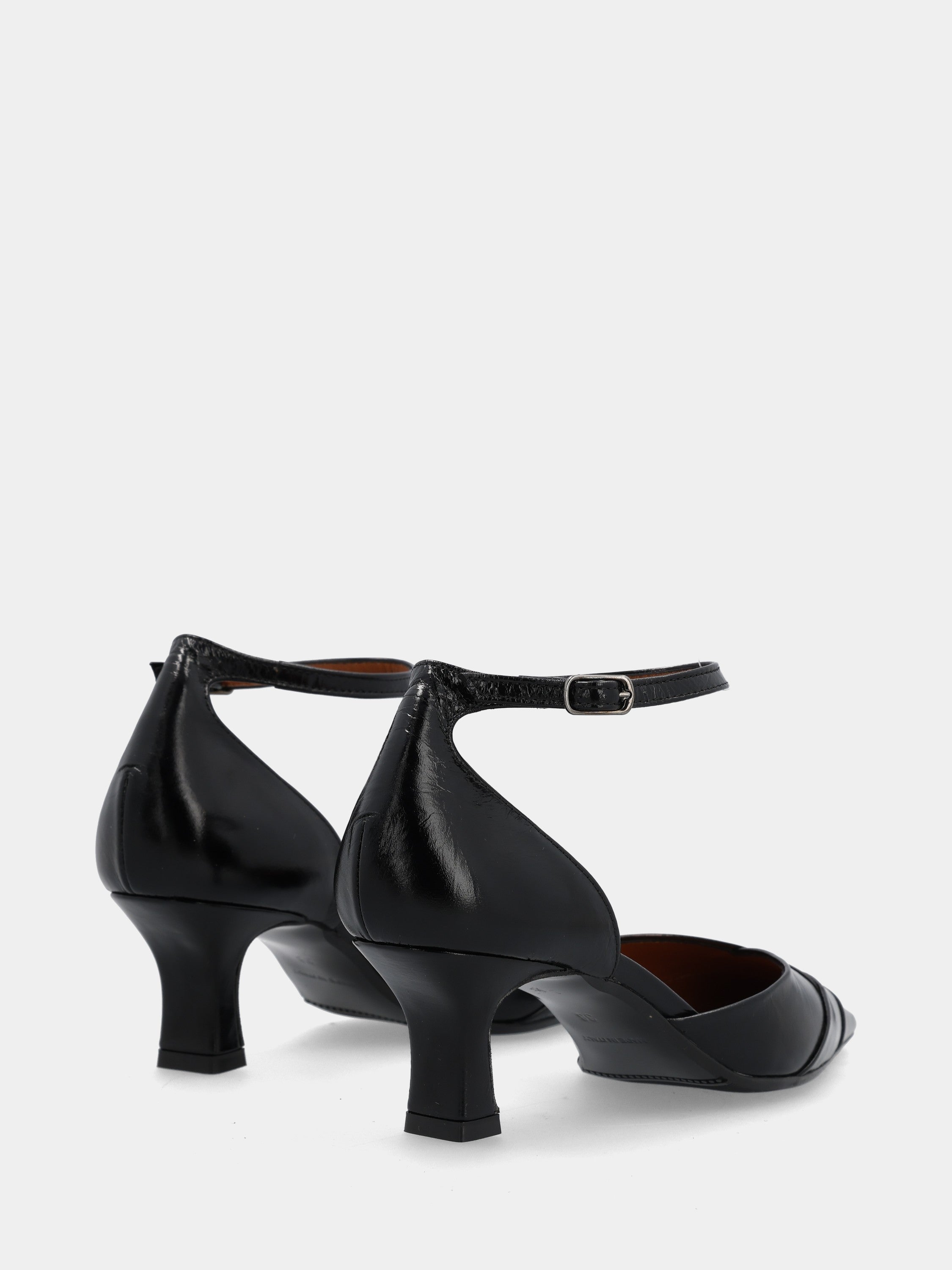 Black calfskin pumps with strap and hollow heel