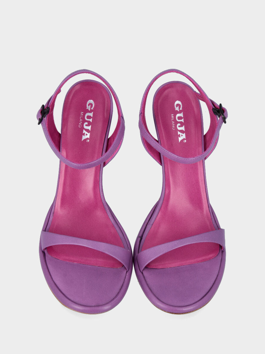 Lilac leather heeled sandal with strap on the sole