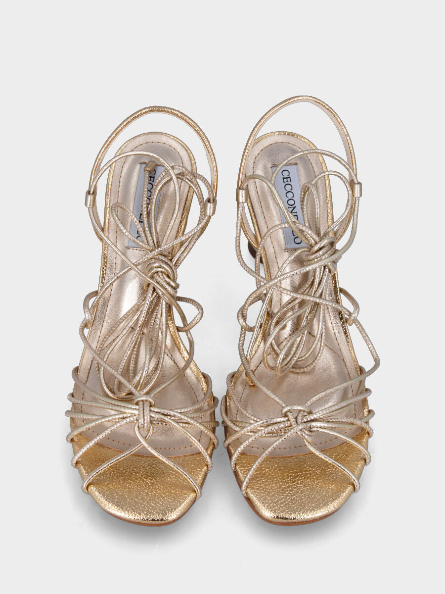 Gold laminated sandal with hourglass heel