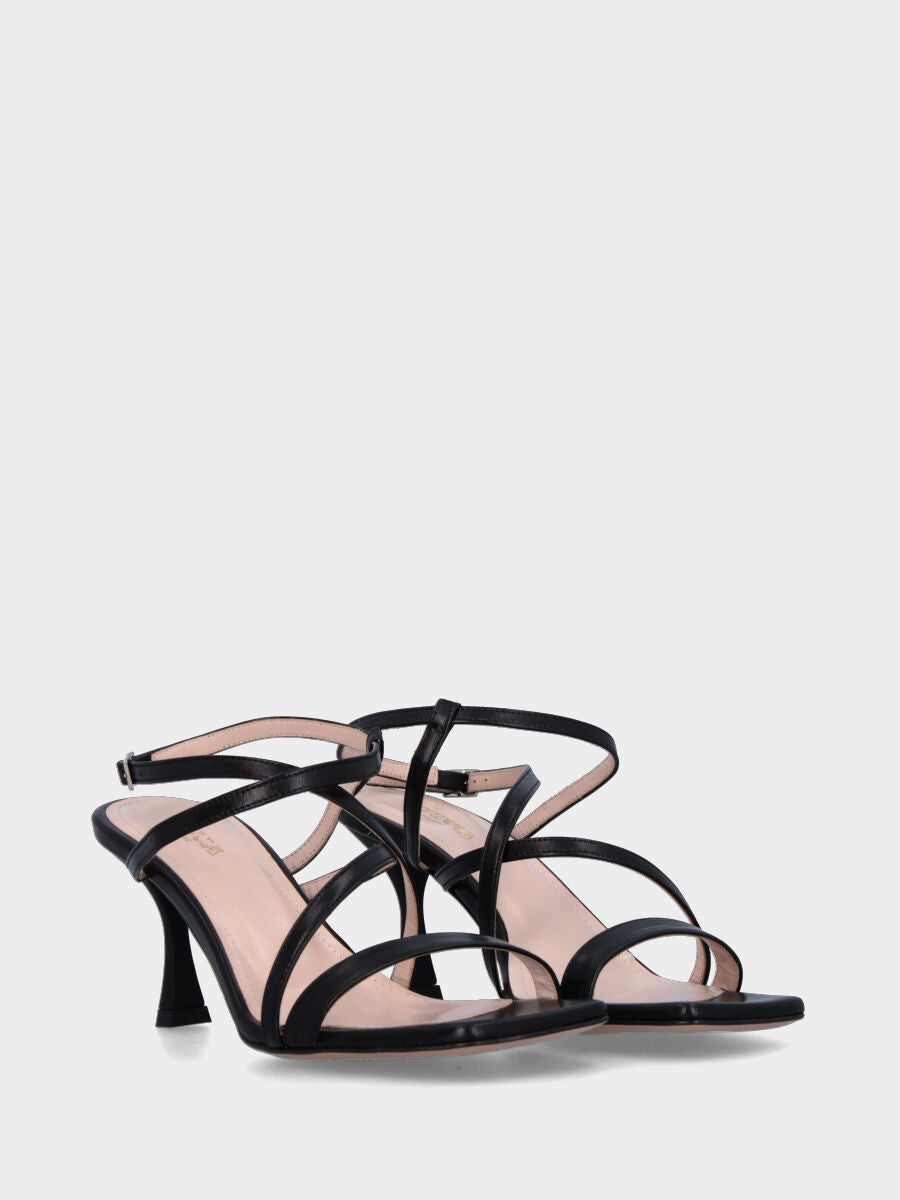 Black leather sandal with crossed straps on the instep