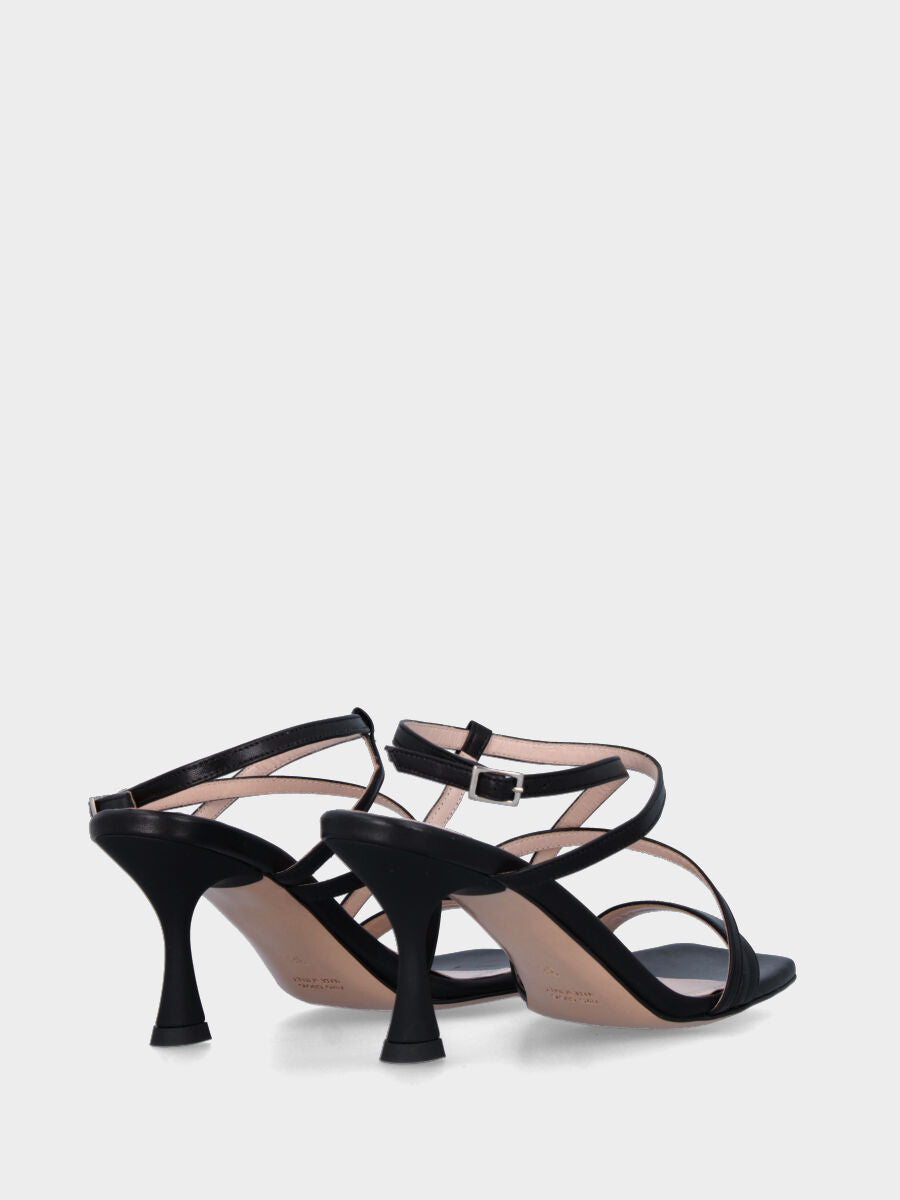 Black leather sandal with crossed straps on the instep