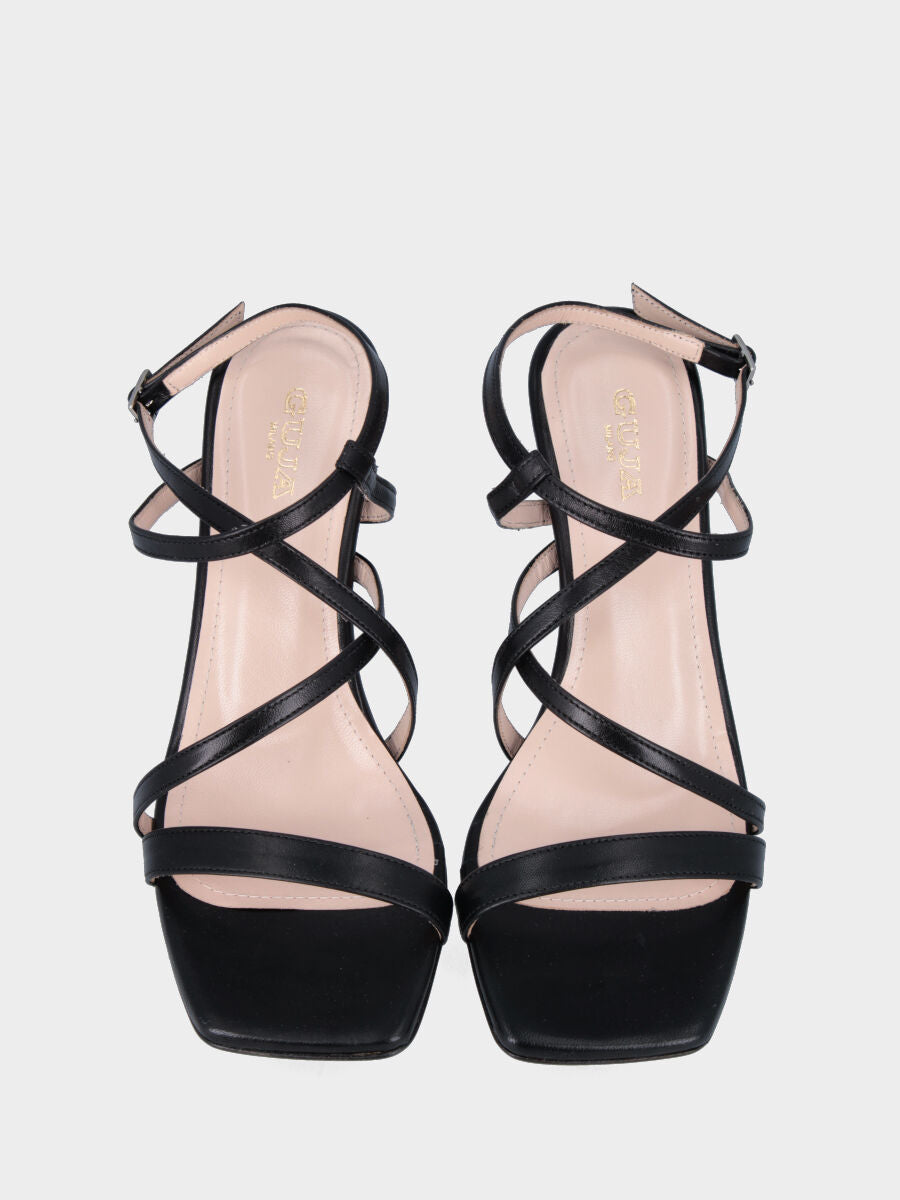 Black leather sandal with crossed straps on the instep