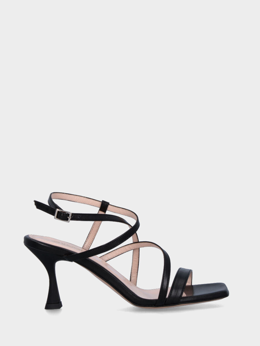 Black leather sandal with crossed straps on the instep