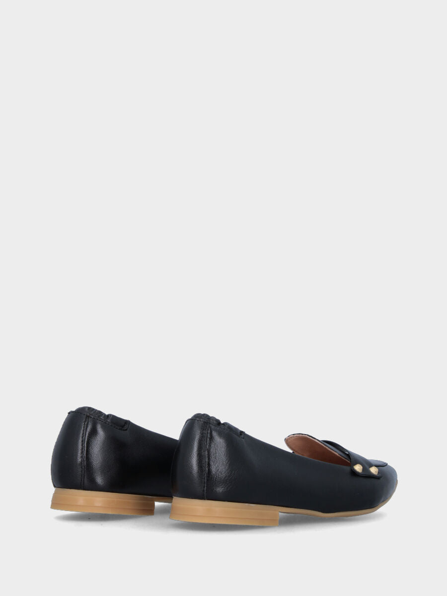 Black leather moccasin with studs and elastic at the heel