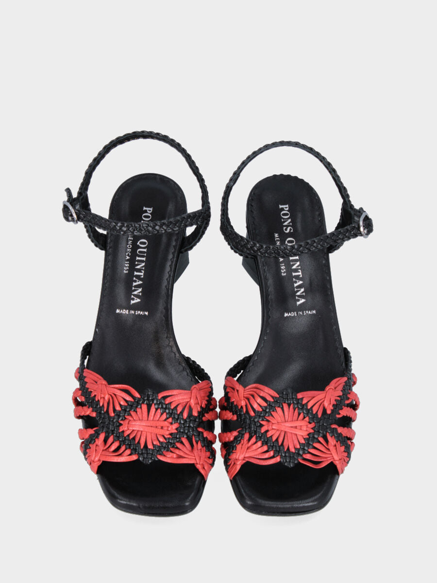Black leather sandal with red braided straps