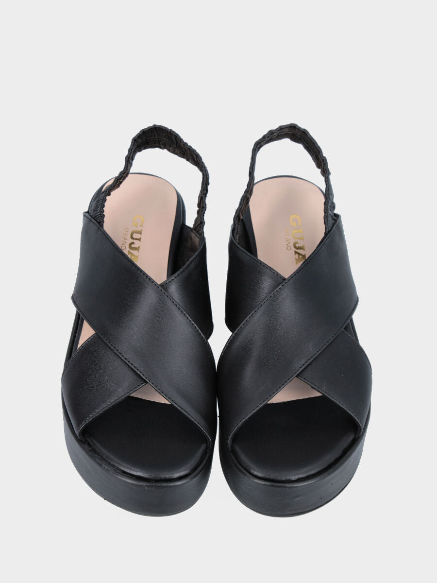 Black leather sandal with crossed straps and wedge
