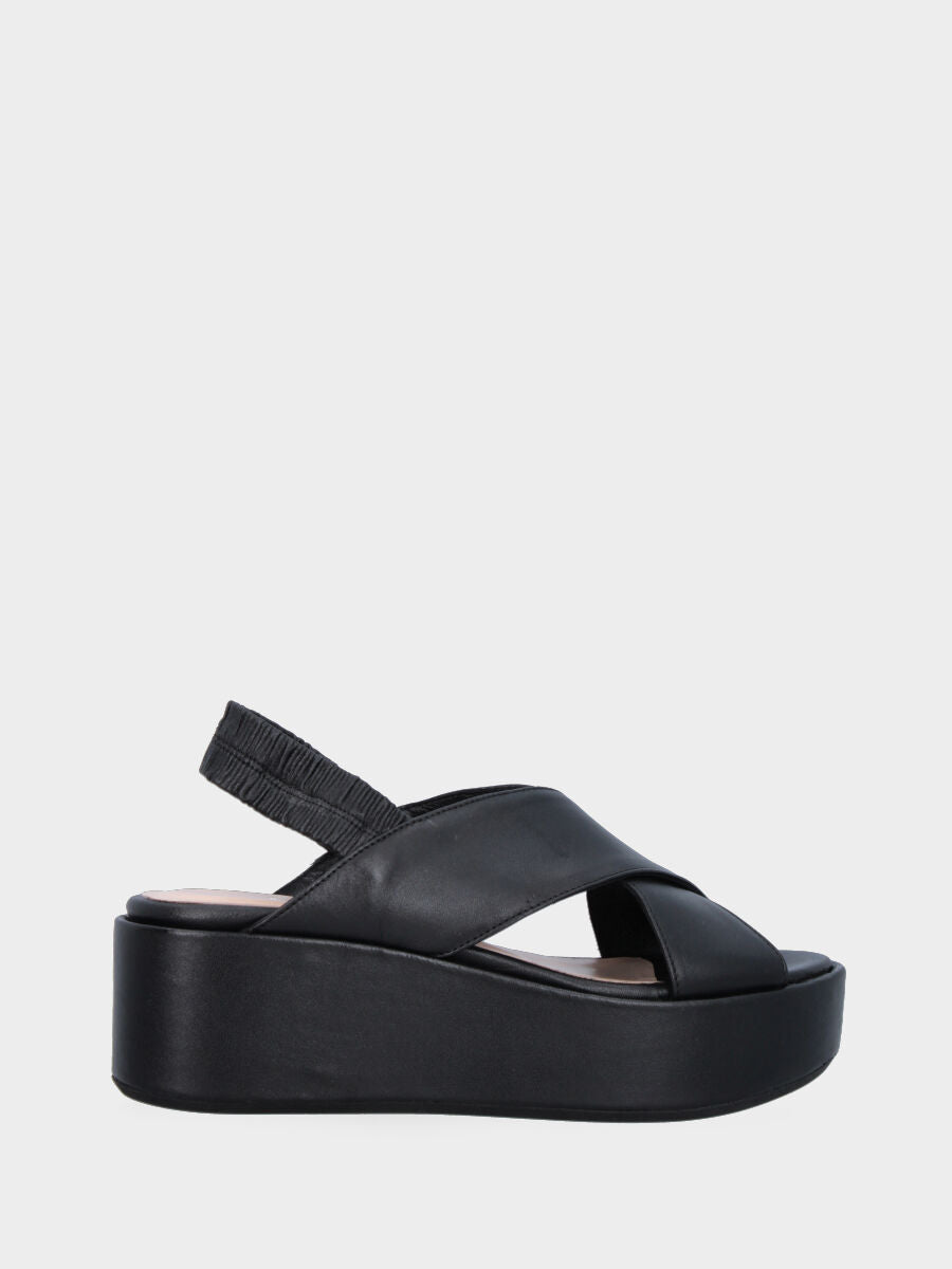 Black leather sandal with crossed straps and wedge
