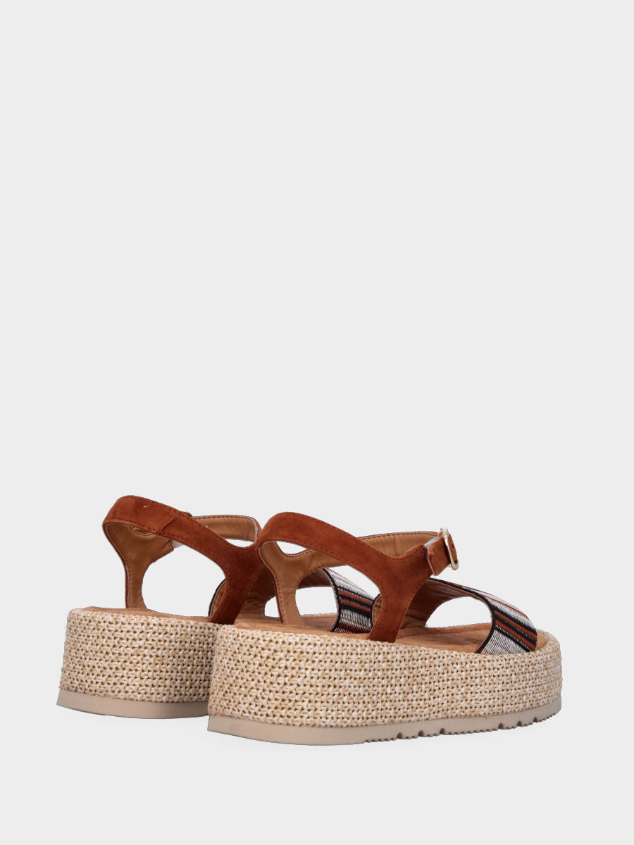 Sandale marron en cuir avec bande en tissu et semelle compensée