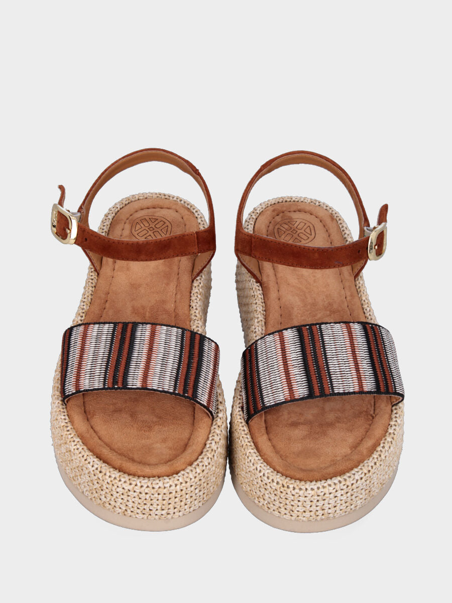 Sandale marron en cuir avec bande en tissu et semelle compensée