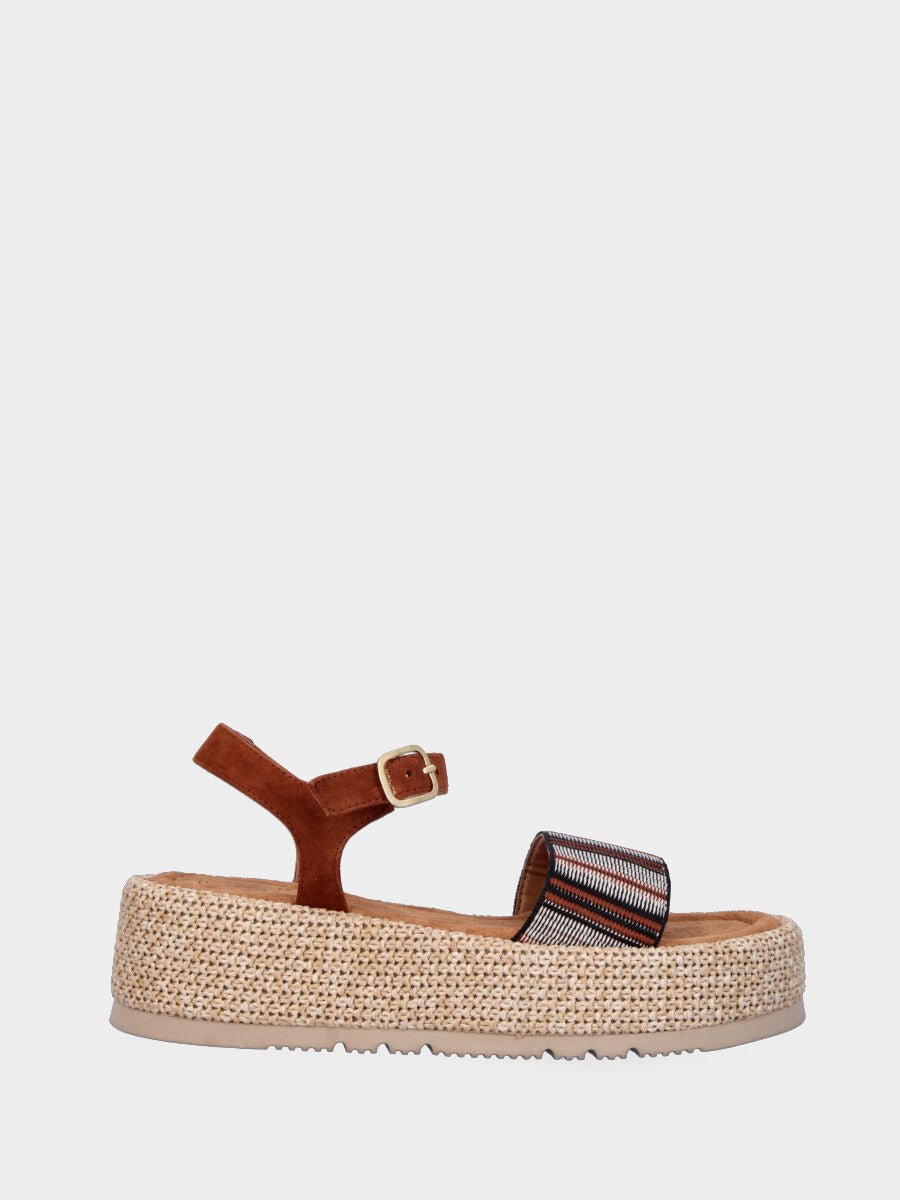 Sandale marron en cuir avec bande en tissu et semelle compensée