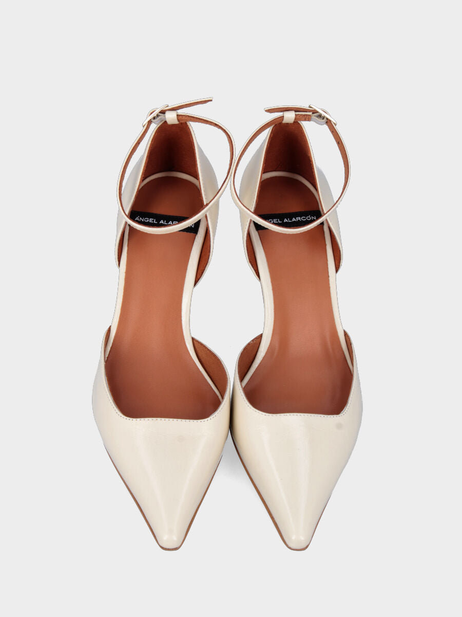 White patent leather pumps with square neckline