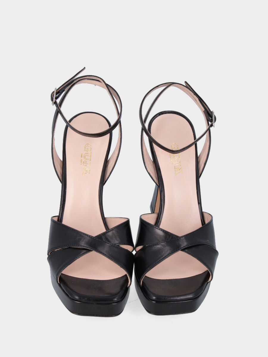 Sandale noire en cuir avec brides croisées et plateforme
