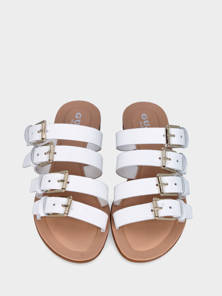 Mule blanche en cuir avec quatre boucles