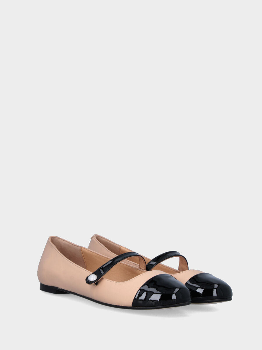 Beige leather ballet flat with black patent toe cap