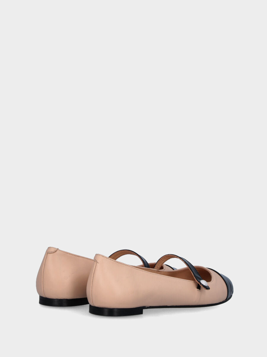 Beige leather ballet flat with black patent toe cap