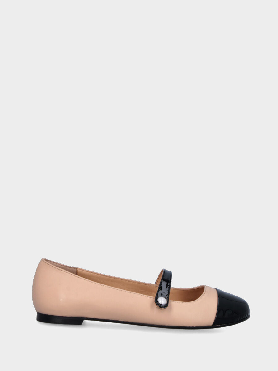 Beige leather ballet flat with black patent toe cap