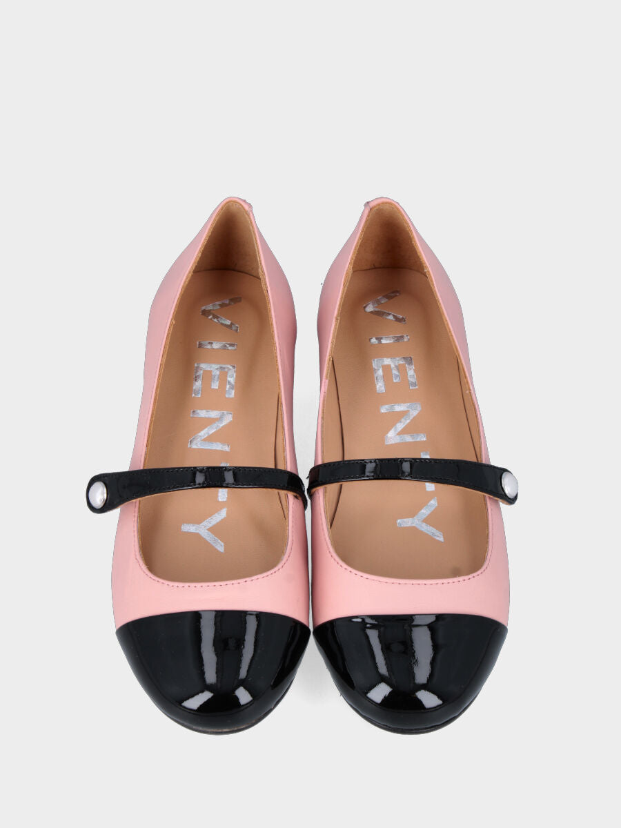 Pink leather ballet flat with black patent toe cap