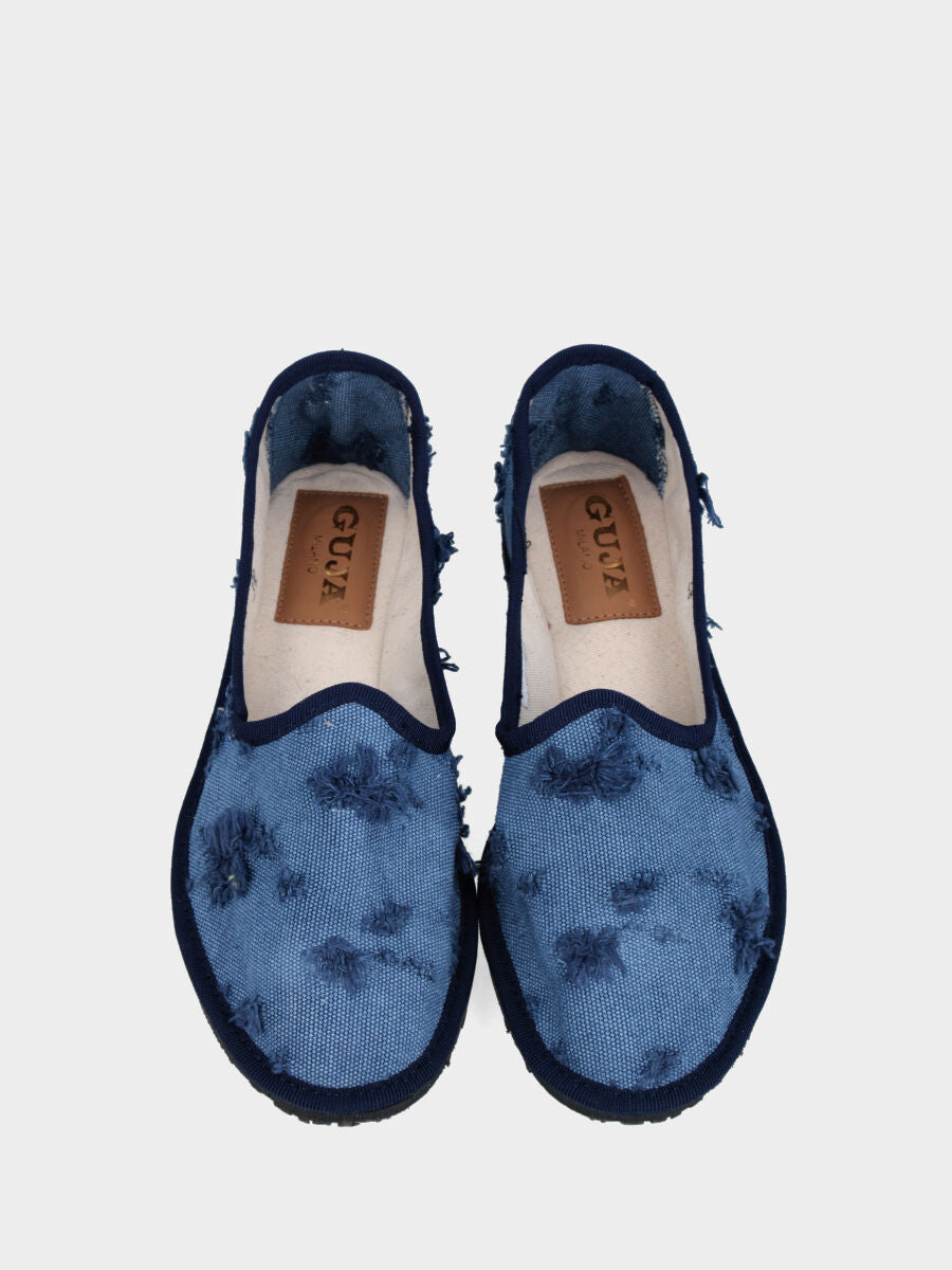 Friulana in tessuto azzurro con strappi e tacco flat
