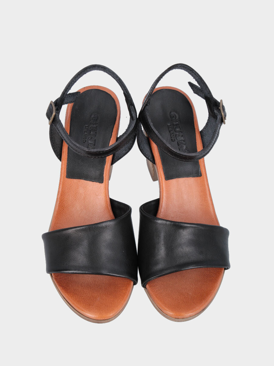 Sandalo monoblocco in vitello nero con fascia ripiegata