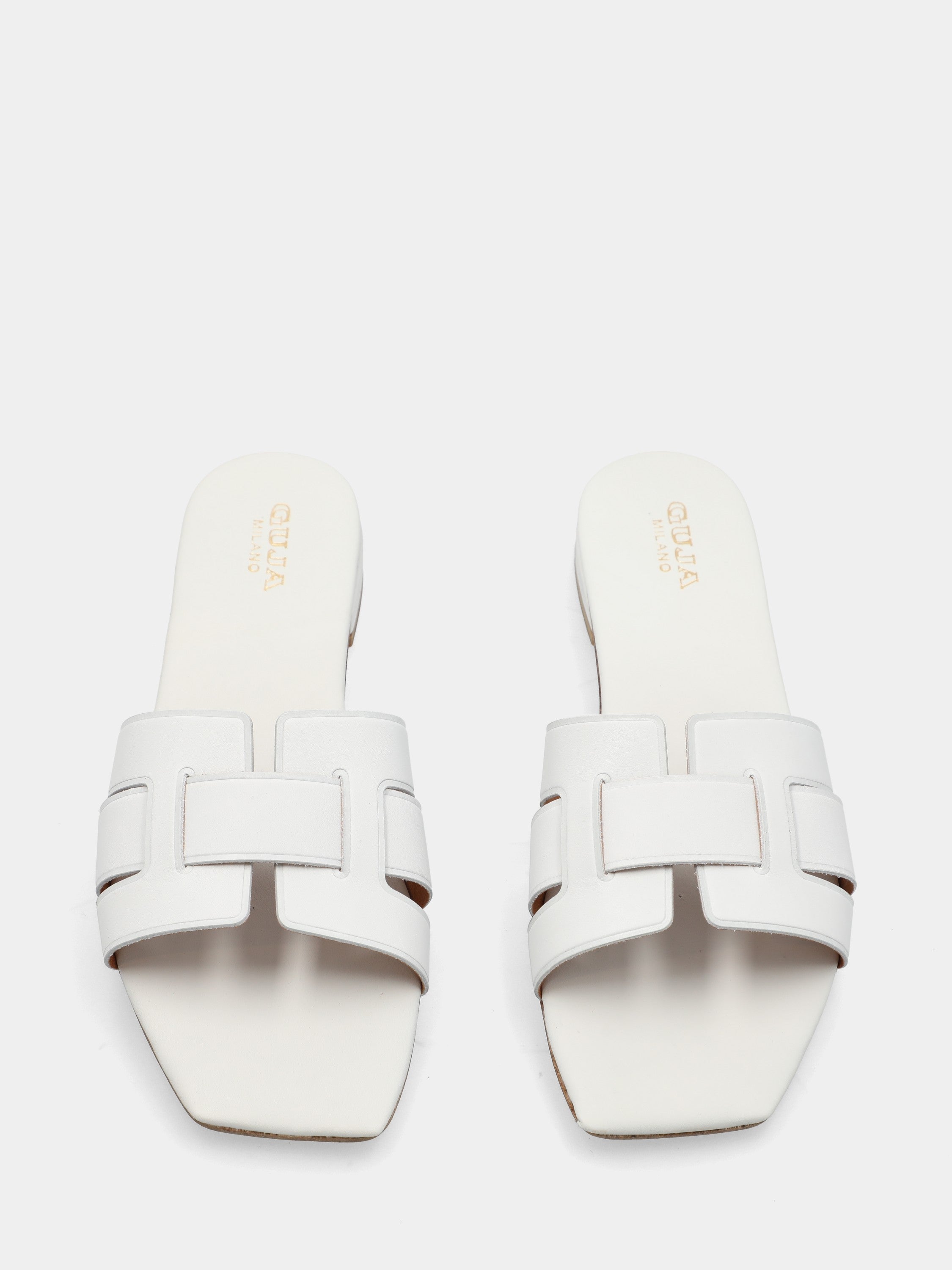 Mule en veau blanc avec brides tressées et bout carré