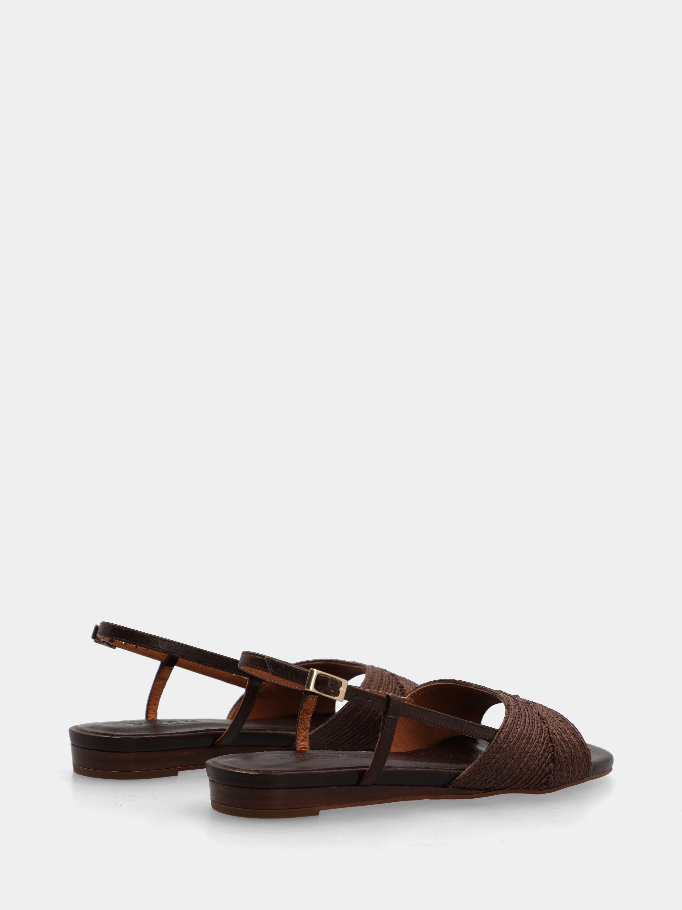 Sandal in dark brown raffia with wedge and woven strap