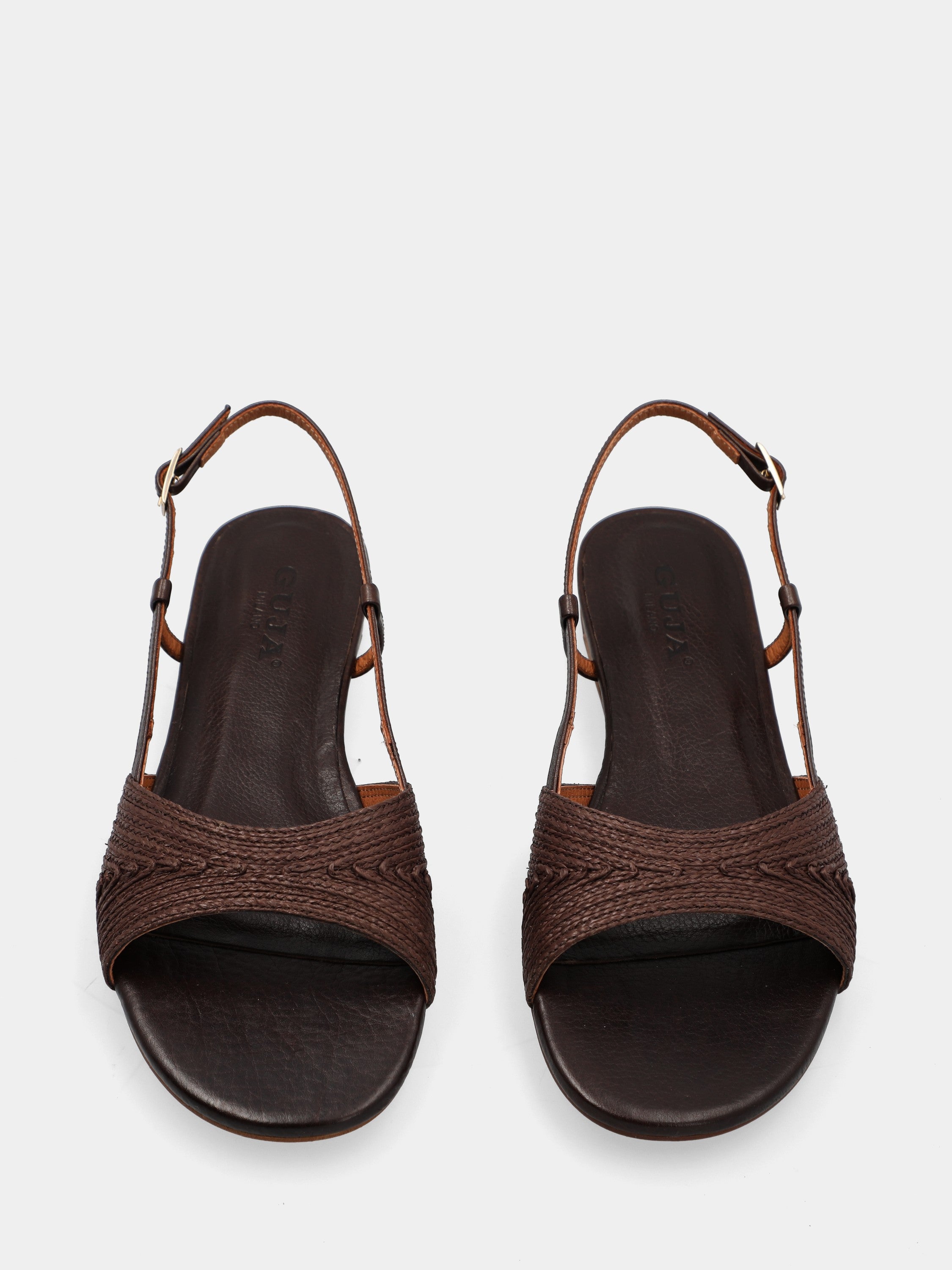 Sandal in dark brown raffia with wedge and woven strap