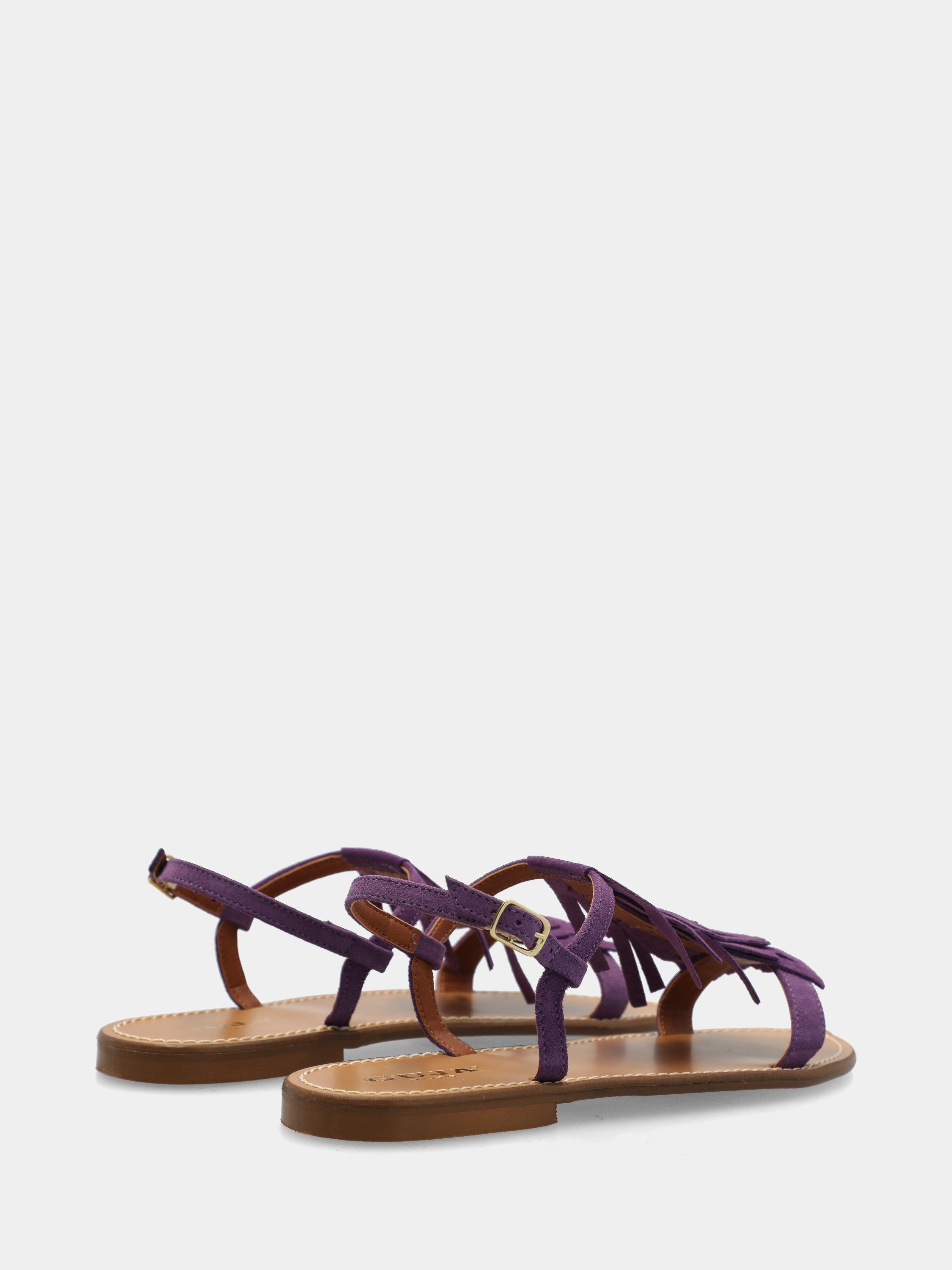 Sandalo flat in camoscio viola con frange sul collo del piede
