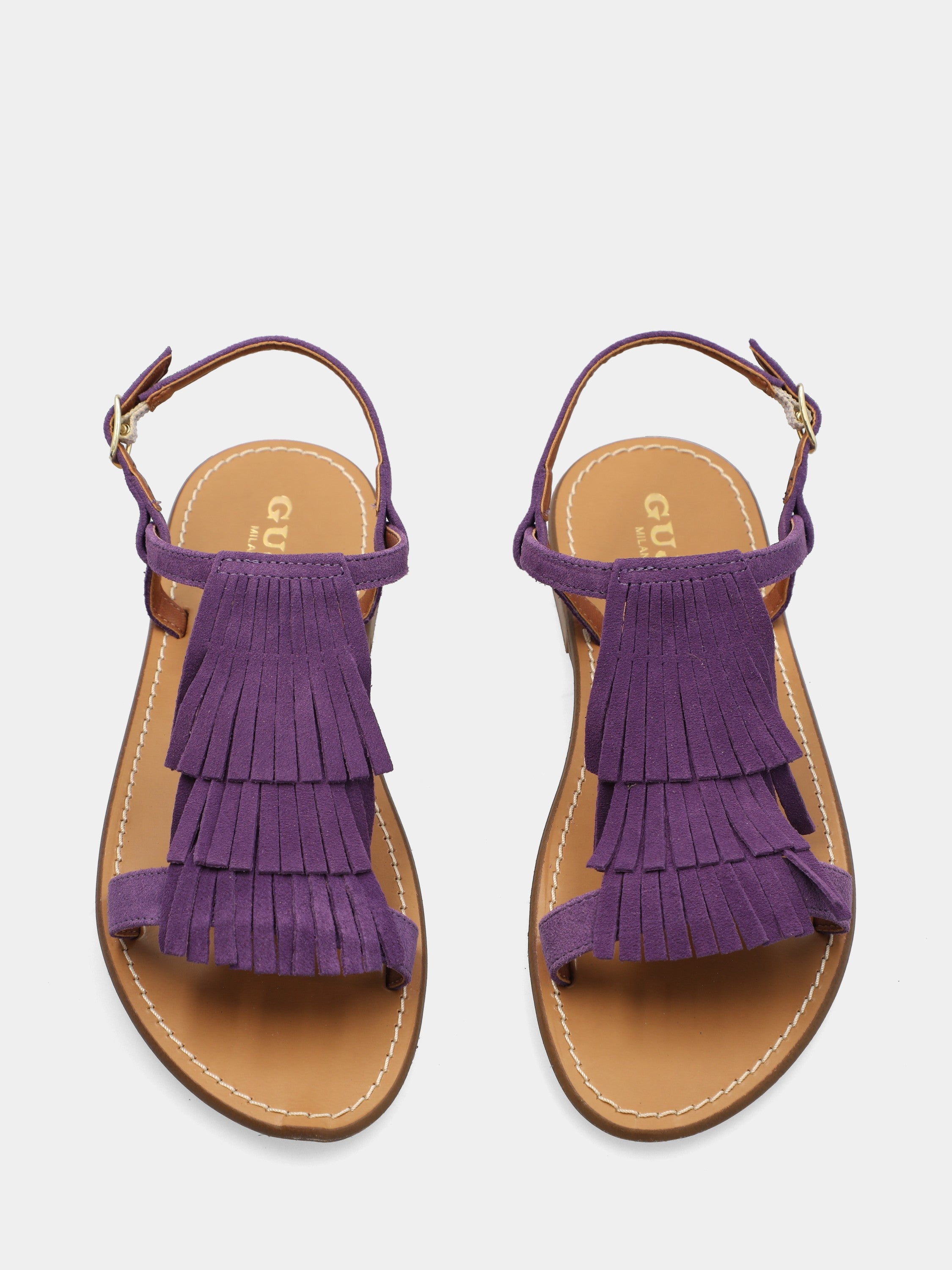 Sandalo flat in camoscio viola con frange sul collo del piede