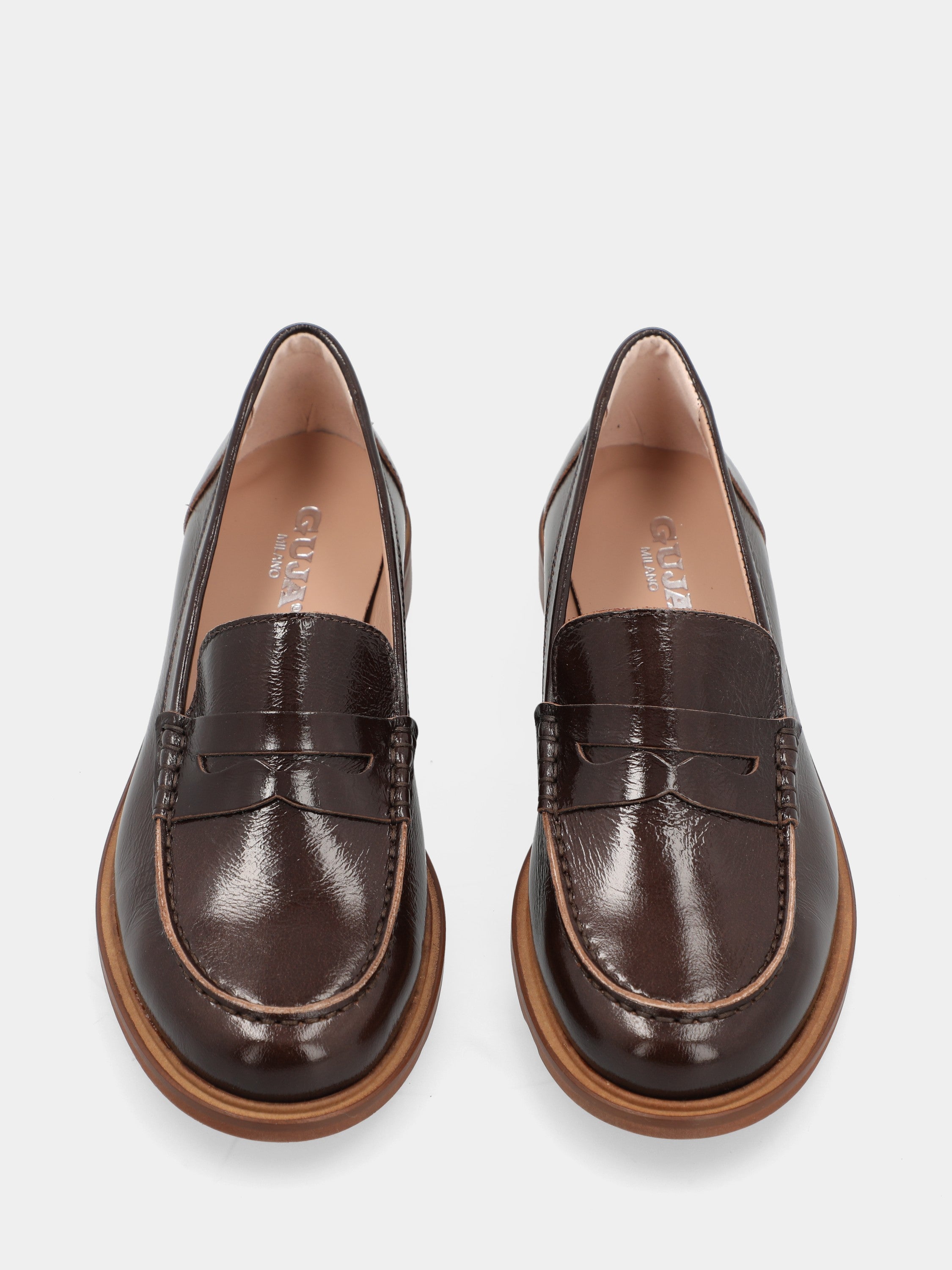 Dark brown patent leather loafer with lion mouth mask detail
