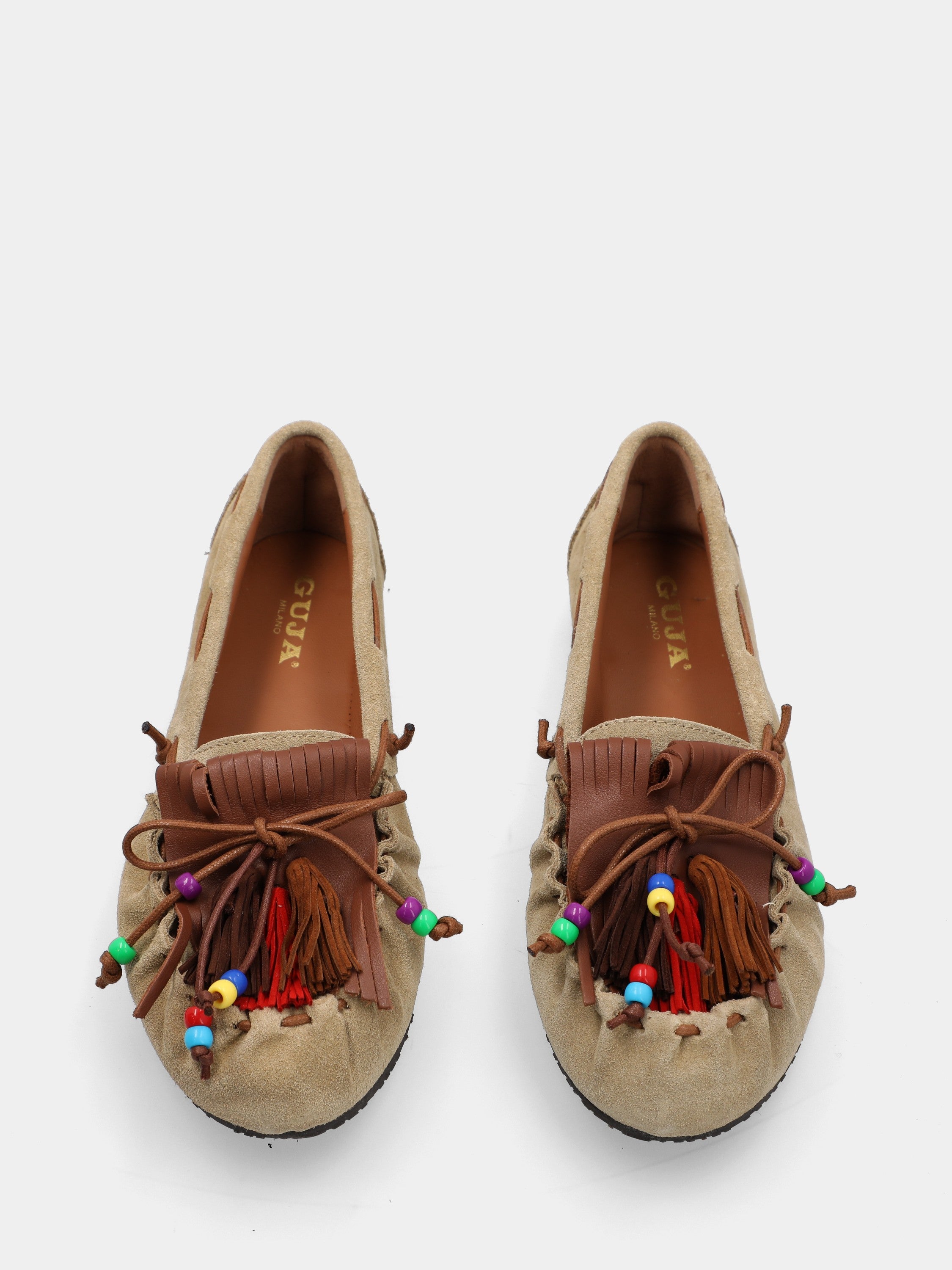 Mocassin en velours beige avec pompons et franges