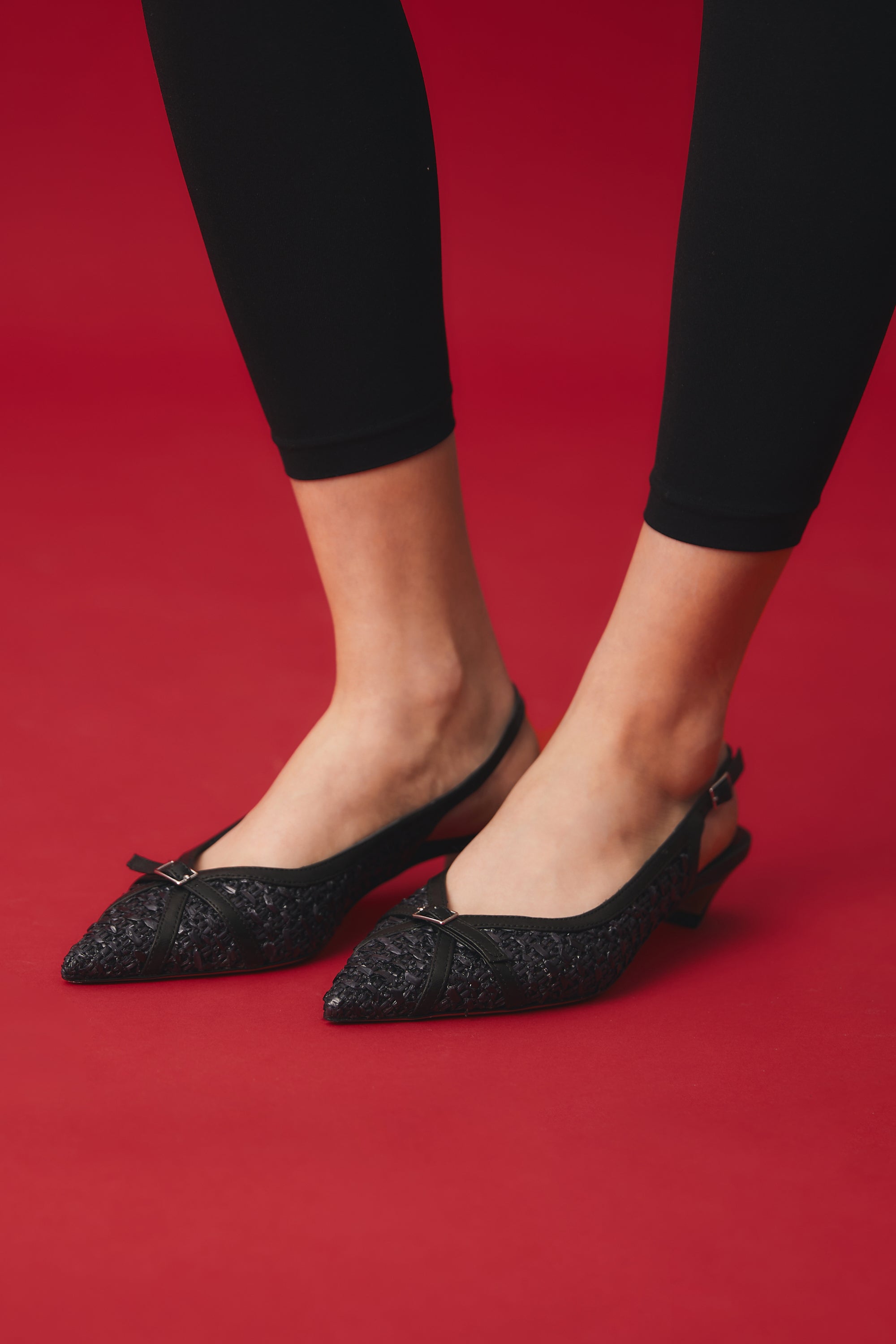 Woven black raffia slingback with tail heel