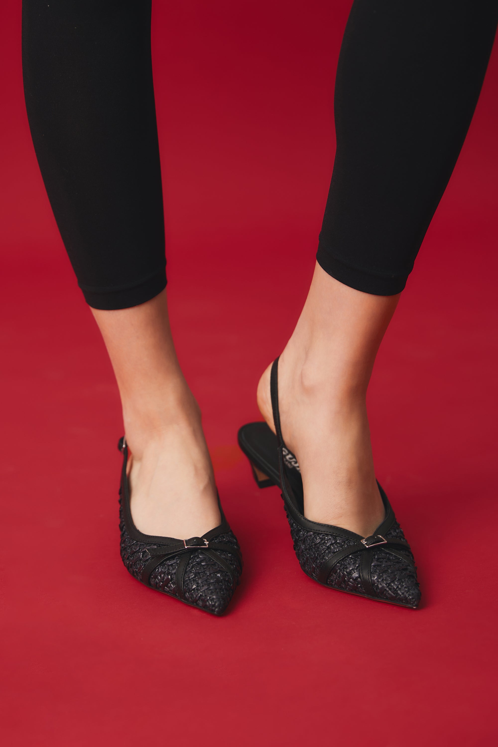 Woven black raffia slingback with tail heel