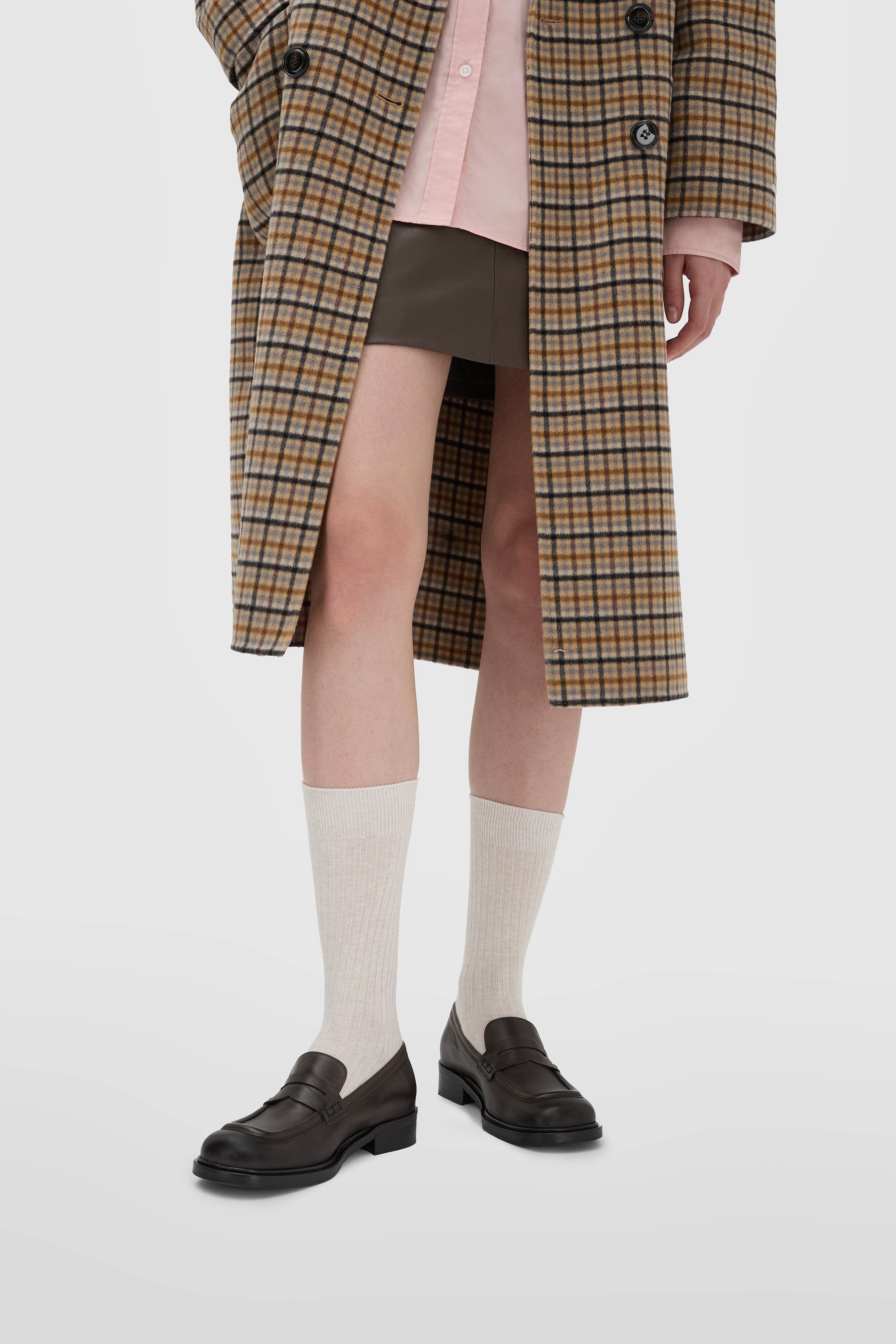 Moccasin in dark brown calfskin with lion's mouth mask