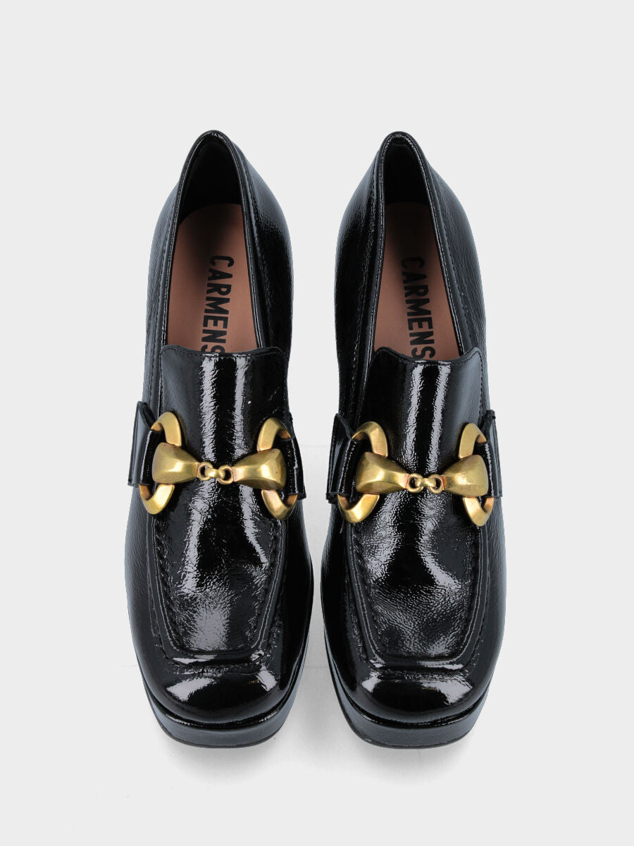 Black leather moccasin with oversized buckle