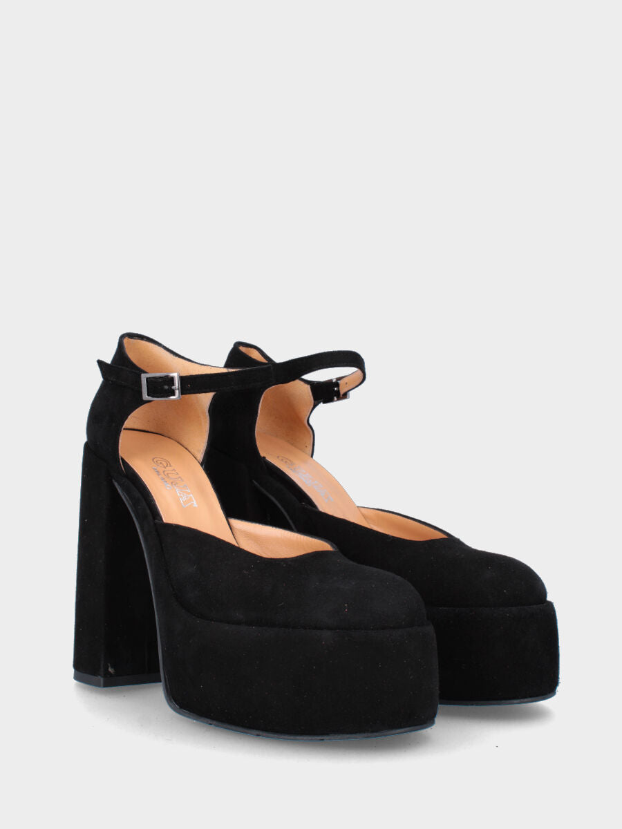 Décolleté nera in pelle aperta ai lati con maxi plateau