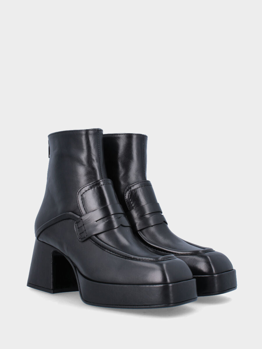 Black leather ankle boot with tab and strap